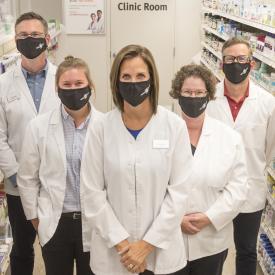 Pharmacists wearing face masks